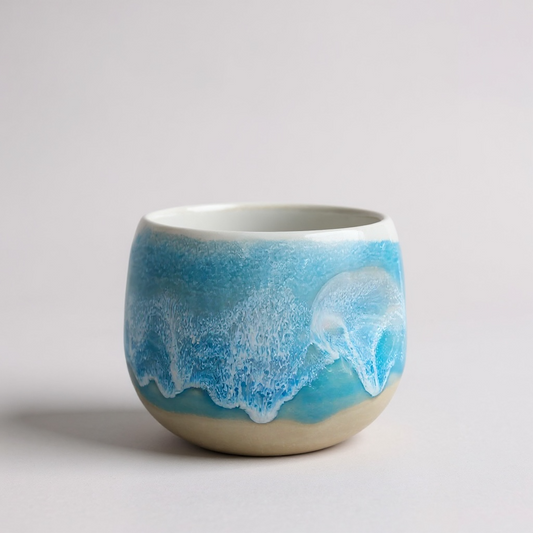 Daumenbecher hellblau weiß